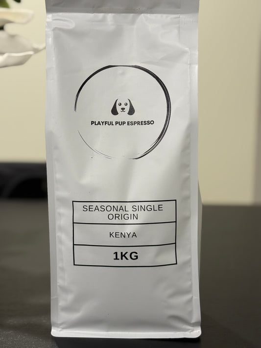 Coffee bag labeled 'Playful Pup Espresso' with details on a neutral background